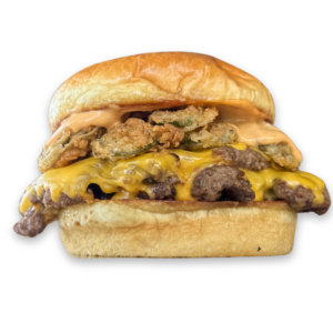 jalapeño Stack Smash burger topped with crispy fried jalapeños, melted cheese, and spicy sauce on a toasted bun